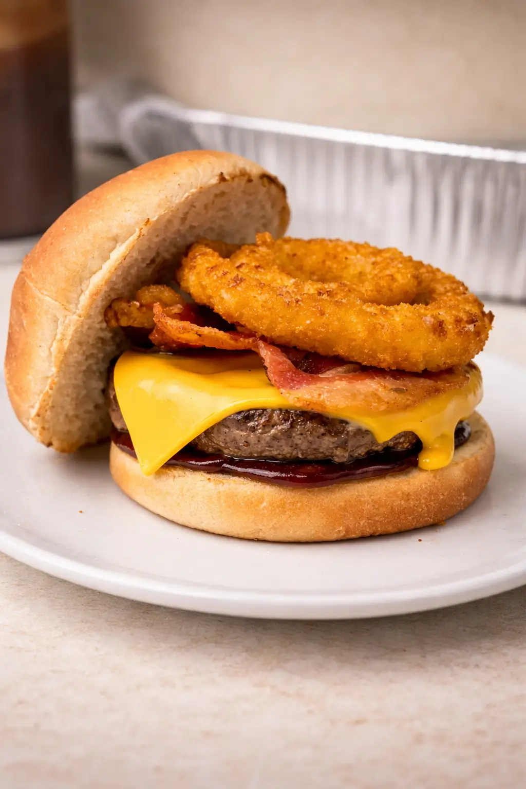 BBQ bacon burger with onion rings